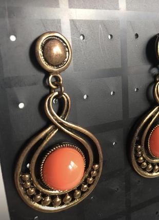 Нові помаранчеві сережки в стилі бохо біжутерія3 фото