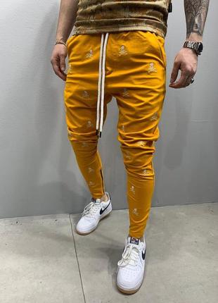 Спортивні штани чоловічі з принтом жовті / спортивні штани штани спортивки з написом3 фото