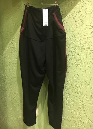 Брюки для беременных фирмы george черные с бордовой полосой, внизу на манжете, евро 48р.