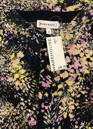 Нереально красивая и стильная брендовая блузка в цветочках.3 фото