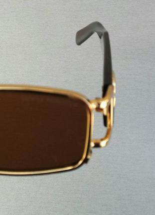 Gentle monster стильні сонцезахисні окуляри унісекс коричневі в золоті з сережкою8 фото