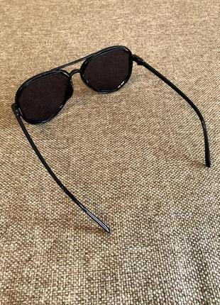 Нові сонцезахисні окуляри в чорному кольорі9 фото