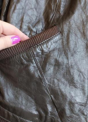 Коричневая кожаная куртка от orsay с манжетами на стоику-м-389 фото