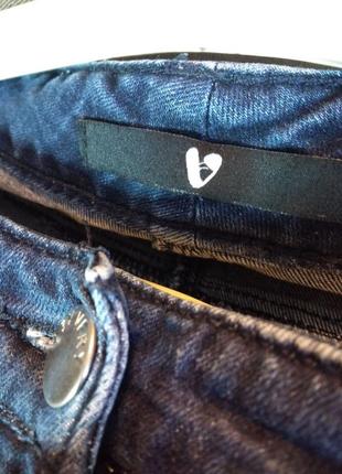 Темно-синие джинсы с дырками5 фото