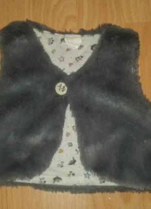 Модна жилетка на 3-9 місяців.