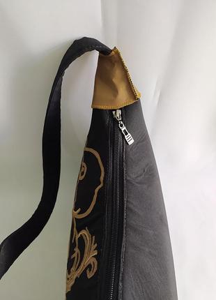 Текстильная сумка ручной работы, украшенная аппликацией и тканево-кожаными накладками5 фото