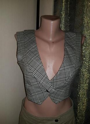 Жилетка в клітку