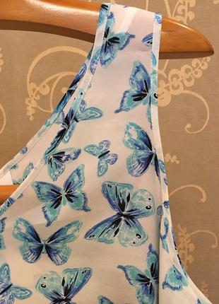 Очень красивая и стильная брендовая блузка в бабочках.5 фото