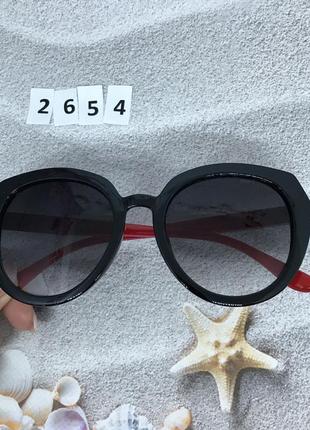 Стильні чорні окуляри з червоними дужками к. 26544 фото
