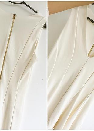 Стильныц кремовий топ з акцентом на талії і асиметричною баскою від h&m2 фото