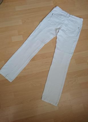 Белоснежные джинсы с дырками6 фото