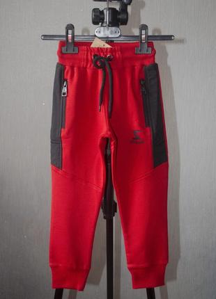 Стильні спортивні штани на резинці з карманами знизу на манжетах1 фото