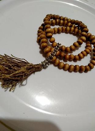 Три браслети з дерев'яних намистин на гумці