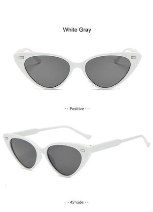Жіночі сонцезахисні окуляри котяче око в білій оправі з металевою вставкою2 фото