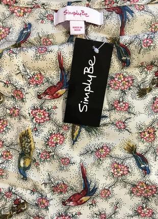 Дуже гарна і стильна брендовий блузка в кольорах і пташок.