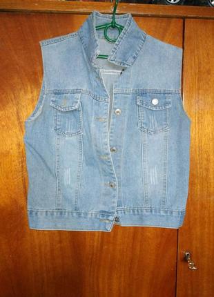 Жилетка джинс жіноча!распродажа!довжина 51 см.,пог 45 см.,ширина 44 см.,пройма рукава 22 см.ціна 450