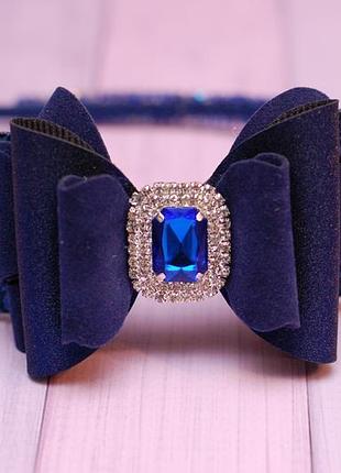Обруч з синім бантом