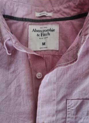 Розовая рубашка от известного бренда.5 фото