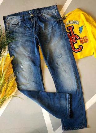 Круті чоловічі джинси з потертостями