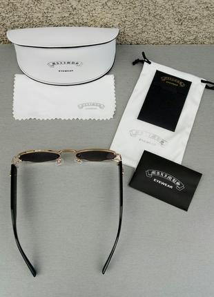 Модные трендовые солнцезащитные очки унисекс узкие овальные черные в золоте4 фото