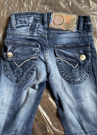 Узкие джинсы с перфорацией,puledro3 фото