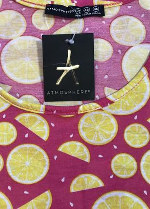 Дуже гарна та стильна брендова маєчка в лимончиках.