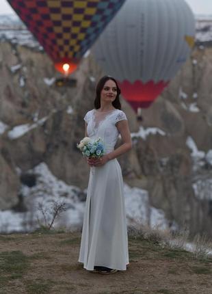 Красиве, ніжне весільну сукню кольору айворі.2 фото