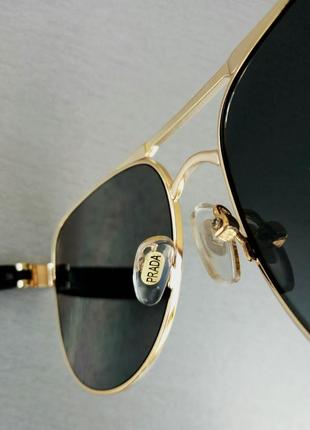 Prada окуляри краплі чоловічі чорні сонцезахисні в золотий металевій оправі8 фото