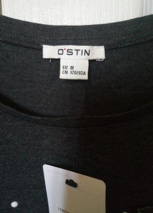 Новенькая футболка ostin с вышивкой.2 фото
