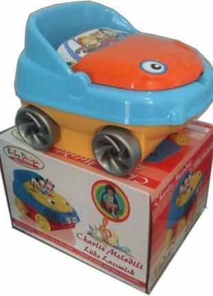 Детский горшок с играющей музыкой при открытие крышки.