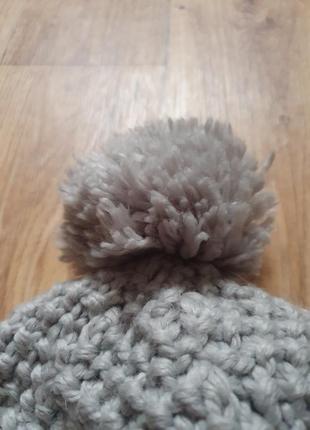 Теплая зимняя шапка с завязками2 фото