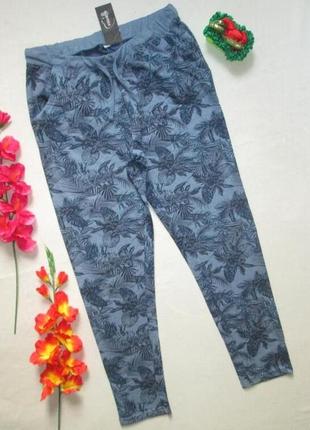 Шикарные трикотажные спортивные штаны в цветочный принт nauveffe.1 фото