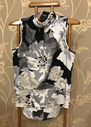 Дуже гарна і стильна брендовий блузка в кольорах.