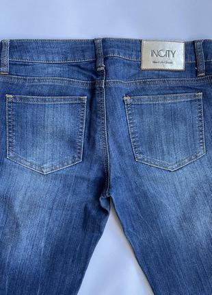Женские джинсы с молниями внизу по бокам1 фото