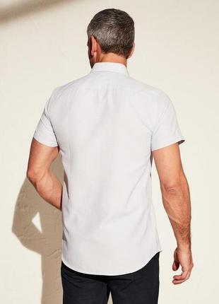 Белая мужская рубашка lc waikiki  лс вайкики с карманом на груди и голубым принтом6 фото