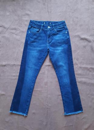Укорочені джинси кльош з бахромою двоколірні джинси1 фото