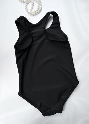 Черный сплошной цельный купальник для девочки pepco 4-5 лет3 фото