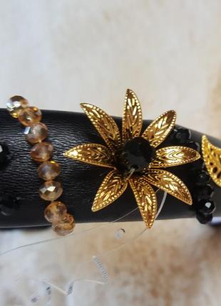 Ободок из черной экокожи для волос с золотистыми цветочками и листиками5 фото