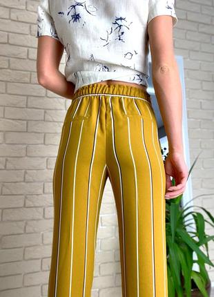 Жовті легкі брюки в смужку білу h&m4 фото