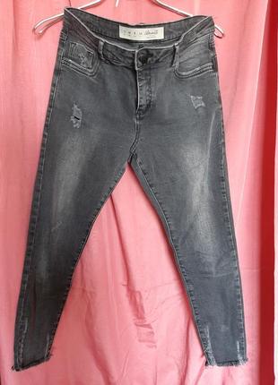 Серые джинсы с дырками3 фото