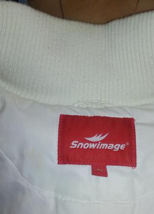 Стеганое зимнее женское пальто snowimage чисто белого цвета.3 фото