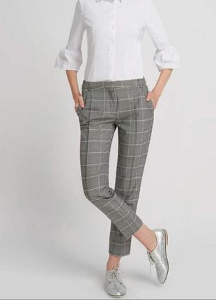 Брюки, штани в клітинку
