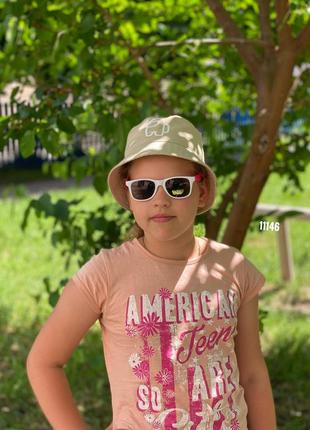 Дитячі сонцезахисні окуляри в білій оправі з рожевими дужками + pop it в подарунок к. 111464 фото