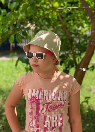 Дитячі сонцезахисні окуляри в білій оправі з рожевими дужками + pop it в подарунок к. 111463 фото