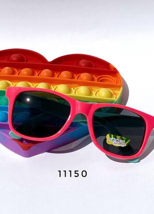 Дитячі сонцезахисні окуляри в рожевій оправі з блакитними дужками + pop it в подарунок к. 111503 фото