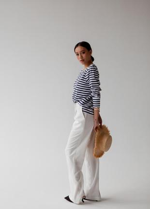 Класичні брюки в білому кольорі3 фото