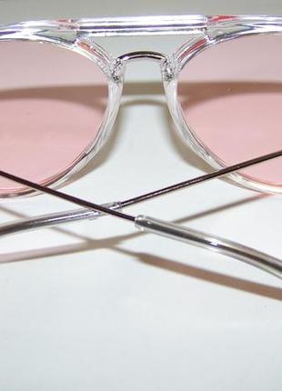 Сонцезахисні окуляри-краплі з рожевою лінзою і напівпрозорої метало-пластикової оправою5 фото