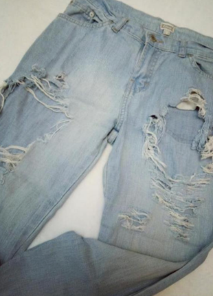 Голубые рваные джинсы etam4 фото