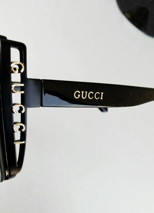 Gucci очки стильные женские солнцезащитные большие черные с золотым логотипом10 фото