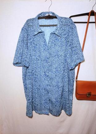 Блакитна блуза сорочка з коротким рукавом в дрібний квітковий принт1 фото